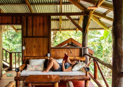 Guests relaxing on the Treehouse Nest deck at Encanta La Vida rainforest eco-lodge Costa Rica
