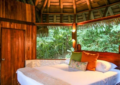 Brisas suite bedroom at Encanta La Vida — jungle views from a beachfront eco-lodge hidden gem in Cabo Matapalo, Osa Peninsula, Costa Rica