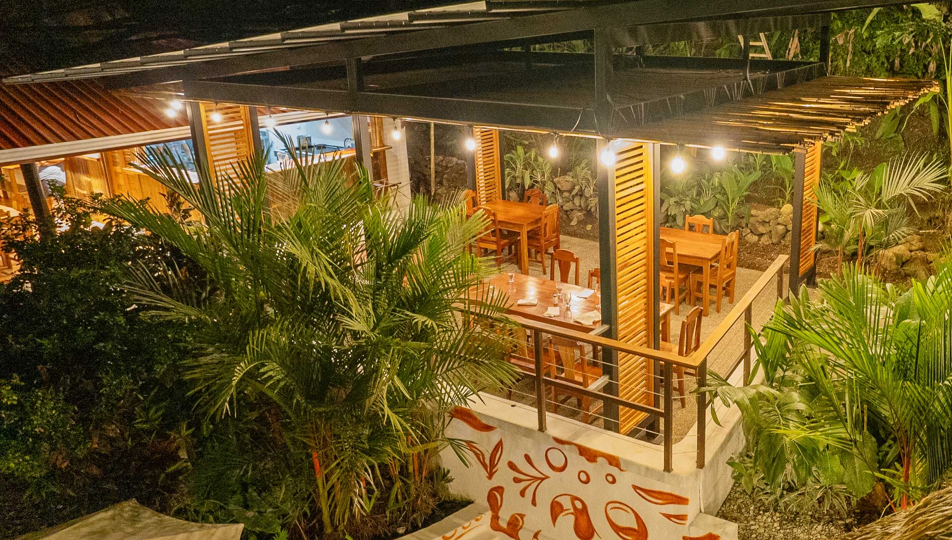Encanta La Vida open-air dining surrounded by Osa Peninsula rainforest — all-inclusive meals at a beachfront eco-lodge in Cabo Matapalo, Costa Rica