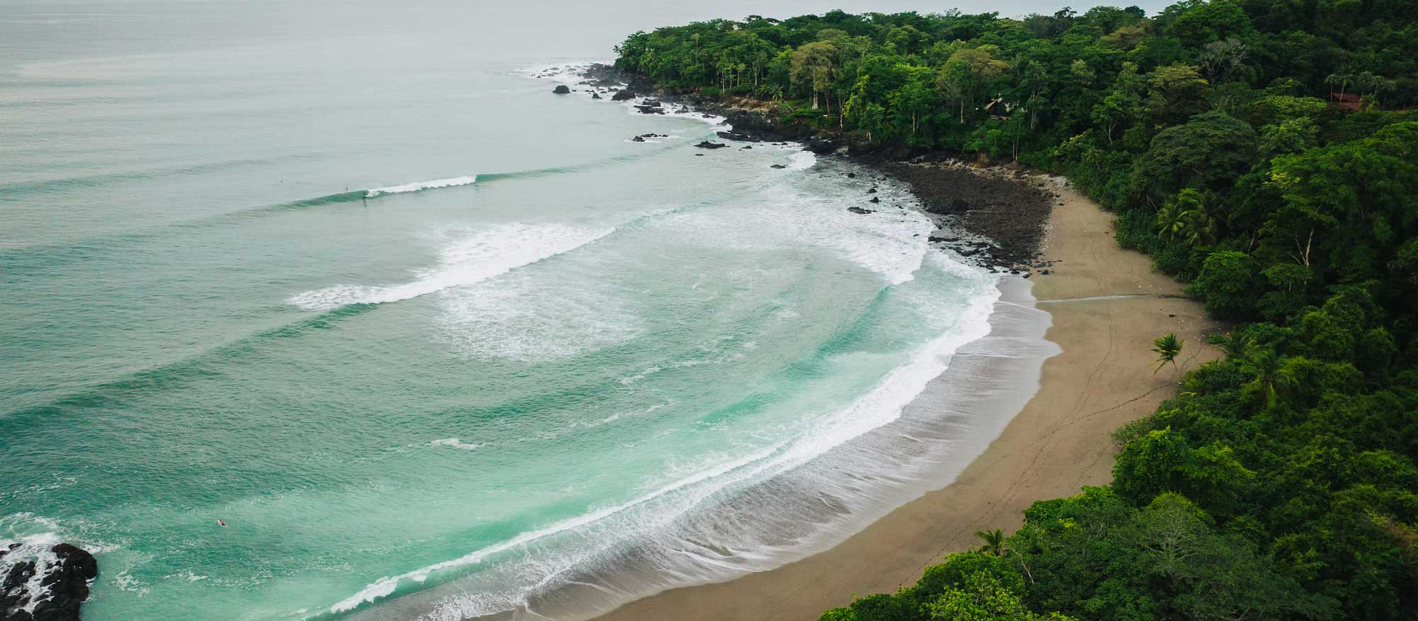 Hidden gems Costa Rica — aerial view of Pan Dulce Beach and Osa Peninsula rainforest from above, Cabo Matapalo